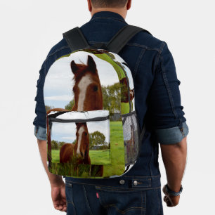 Young Chestnut Horse Sniffing A Banksia Bush, Printed Backpack