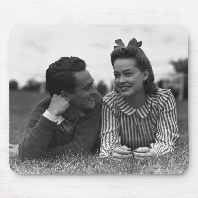 Young couple lying on grass mouse mat (Front)