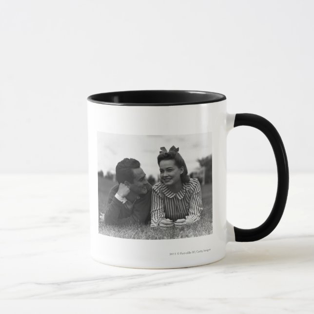Young couple lying on grass mug (Right)