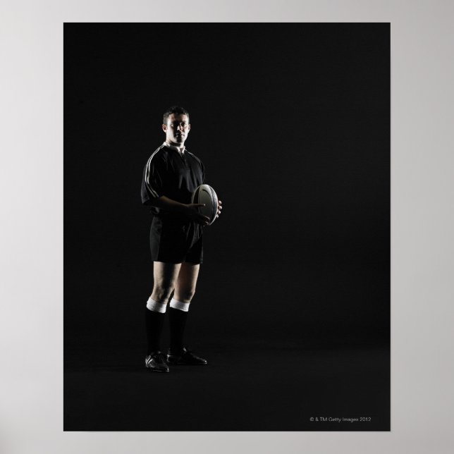 Young man holding rugby ball, portrait poster (Front)