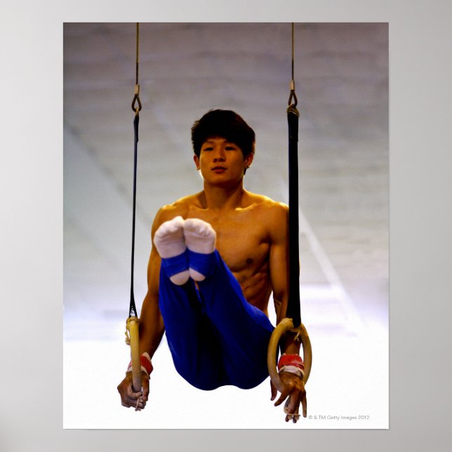 Young man practicing gymnastic rings poster (Front)