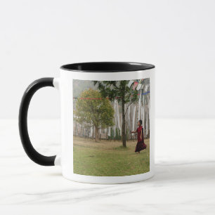 Young monk and prayer flags mug