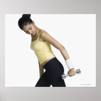Young woman exercising with a dumbbell