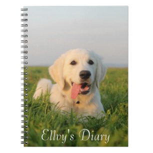 Your cute puppy on a spiral notebook