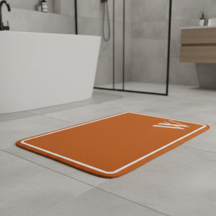 Your monogram in burnt orange bath mat