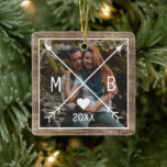 Your Rustic Elegant Monogrammed Love Heart Arrows Ceramic Ornament<br><div class="desc">Discover a unique,  classic,  and trendy Christmas tree ornament that offers a rustic and decorative touch. This ornament provides space to customize with a photo,  initials,  and the year of your choice,  set against a weathered farmhouse barn wood plank texture pattern for that country cottage feel.</div>
